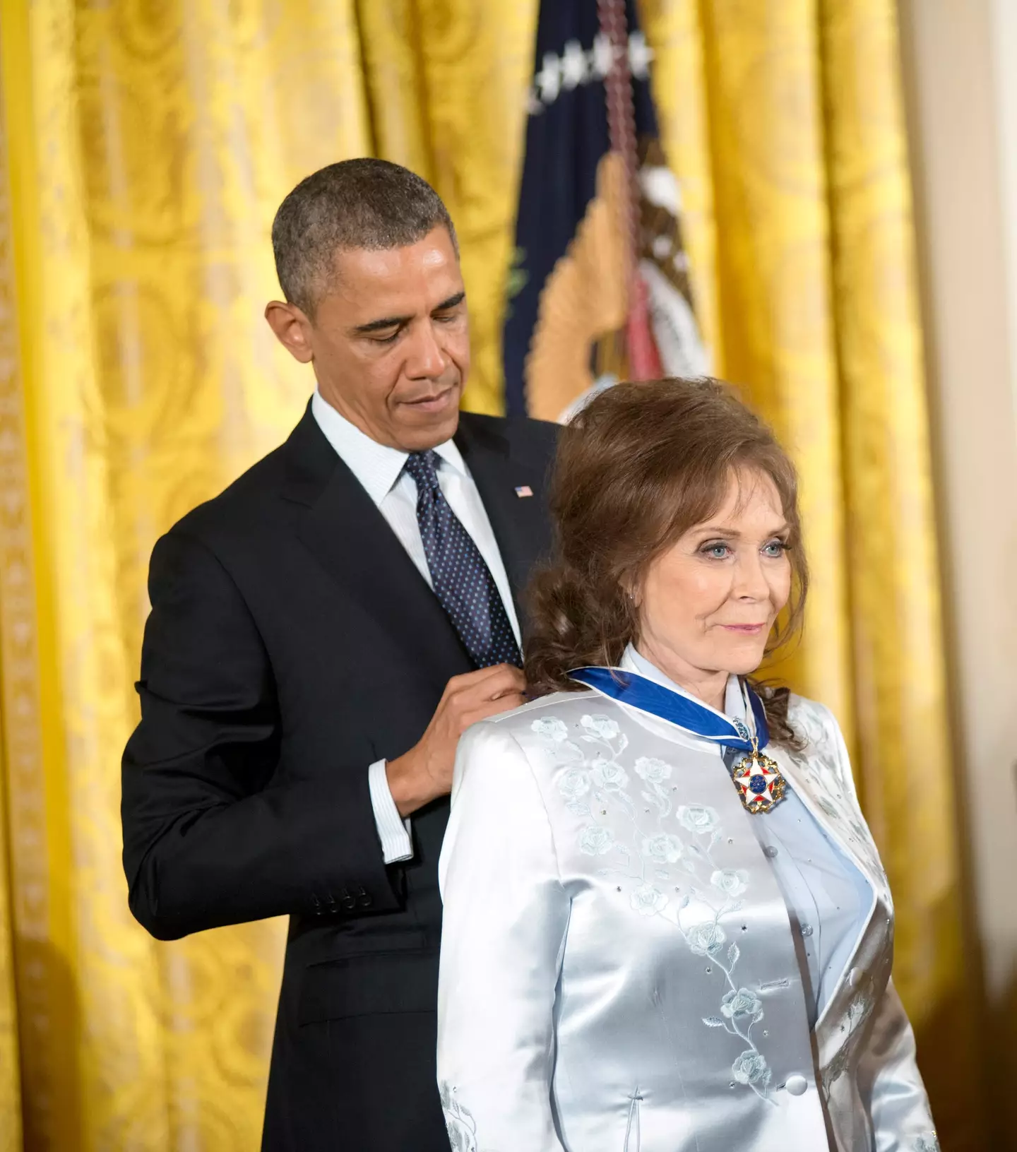 President Obama presenting the Medal of Freedom to Loretta Lynn in 2013.