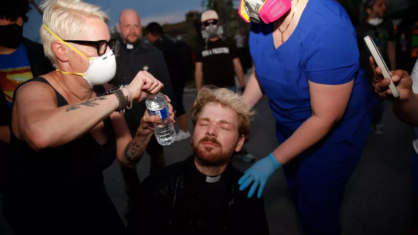 Shocking moment ICE agents shoot 'praying' pastor in head with pepper ball during 'peaceful' protest