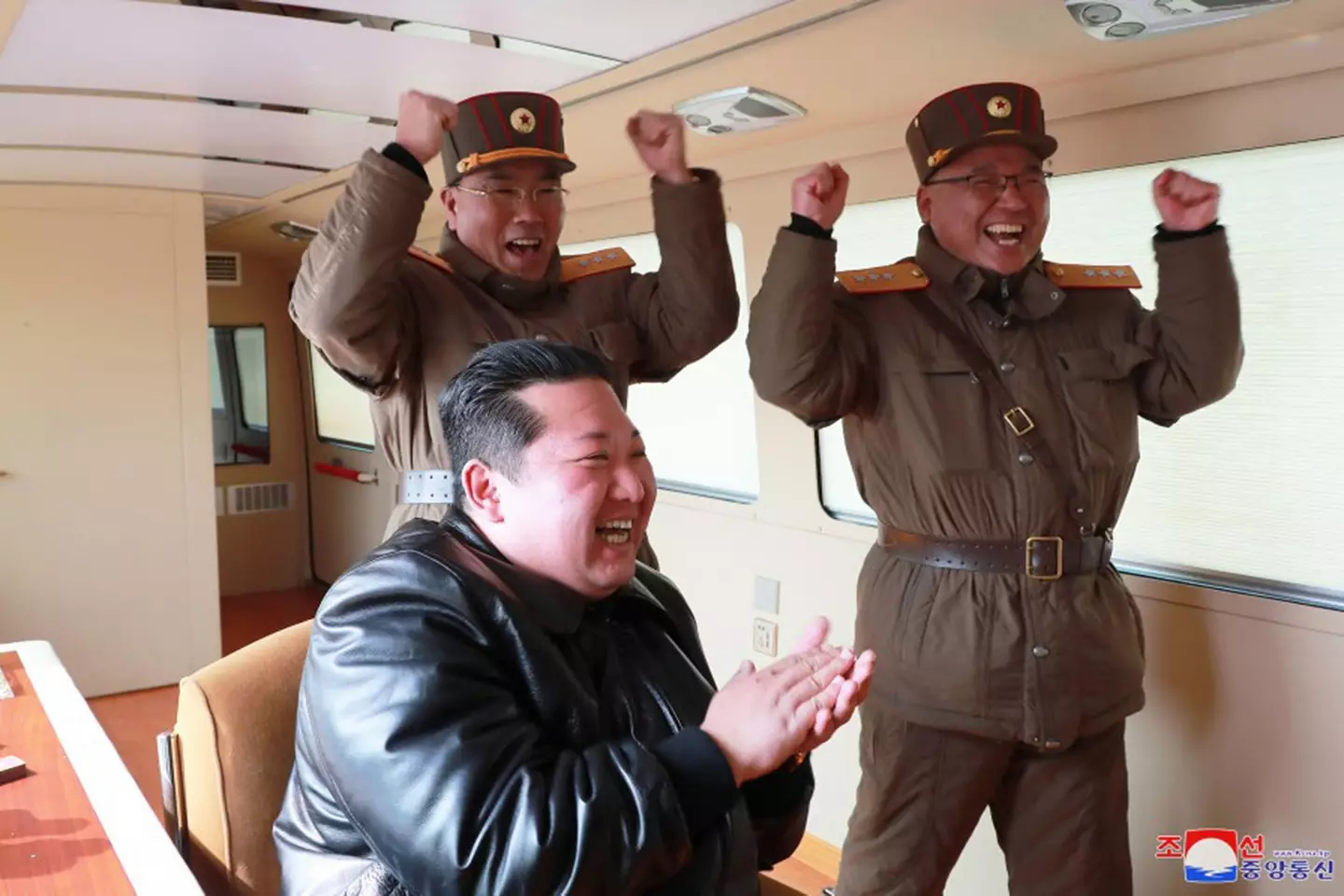North Korean leader Kim Jong-un overseeing missile launch,