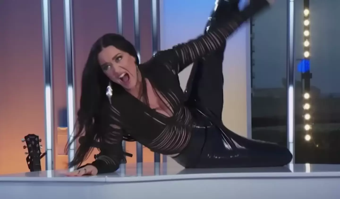 Perry bashed out a bit of air guitar.