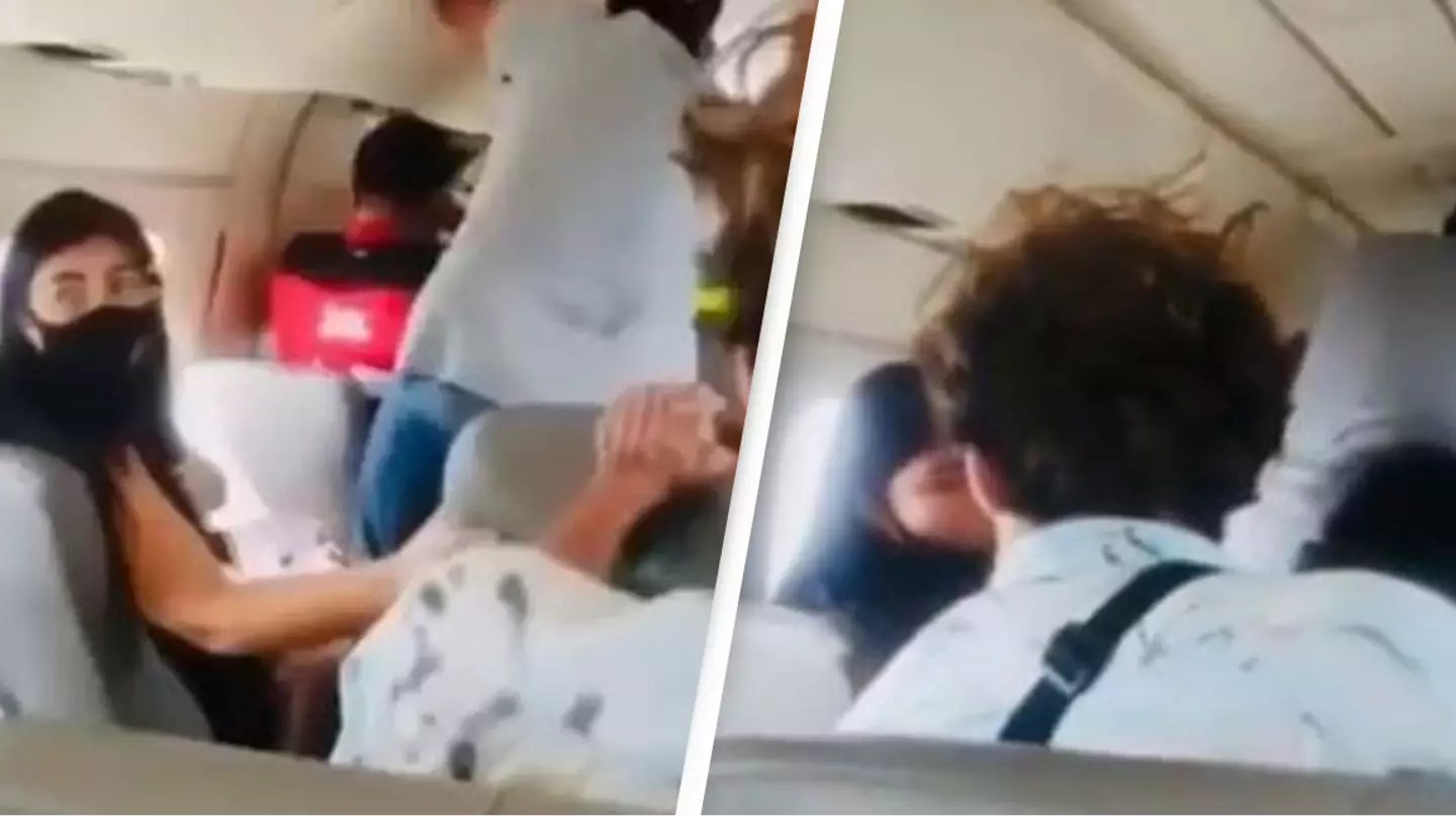 Passengers Desperately Hold Plane Door Closed After It Opens Mid-Flight