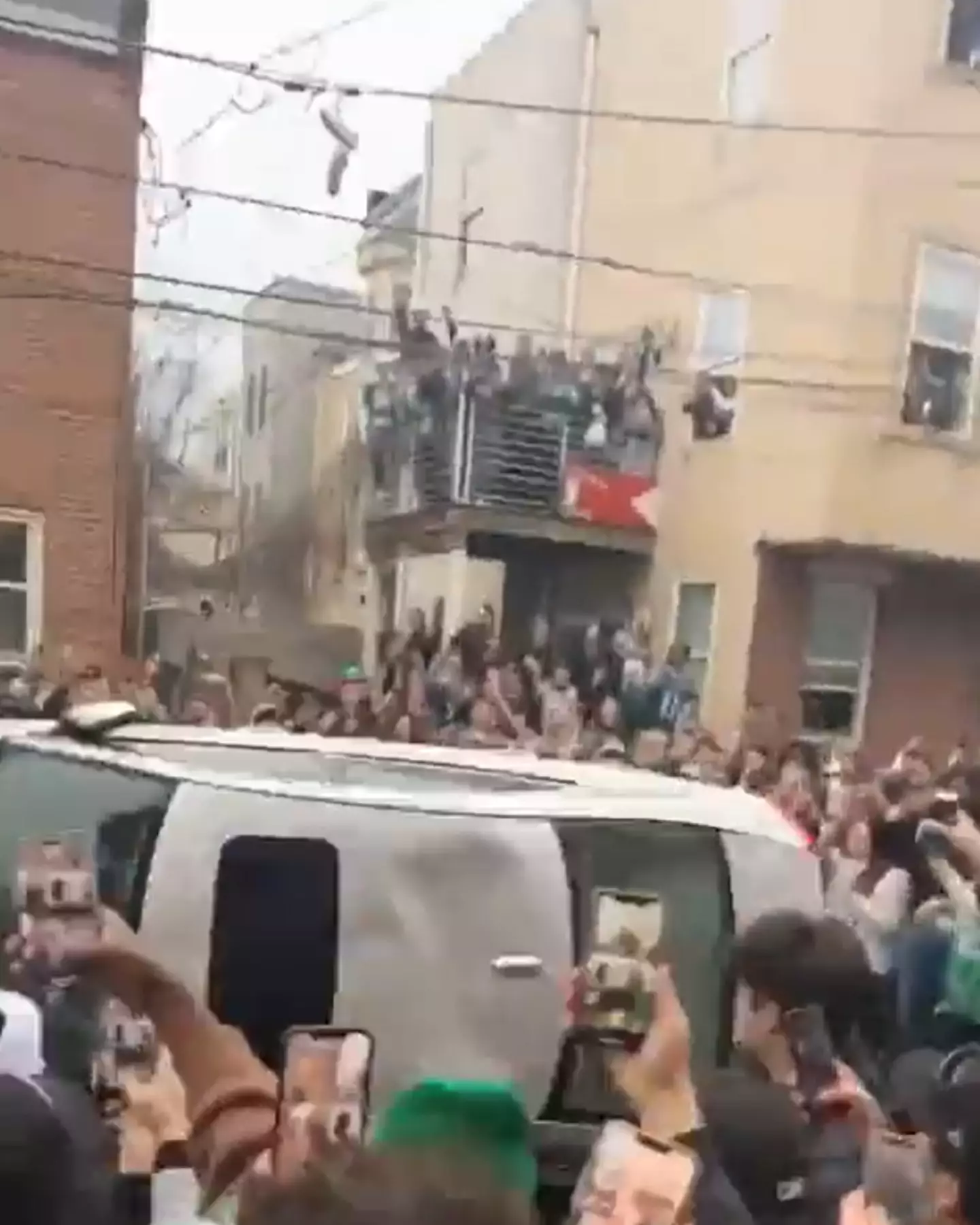Fans ended up flipping a parked car over.