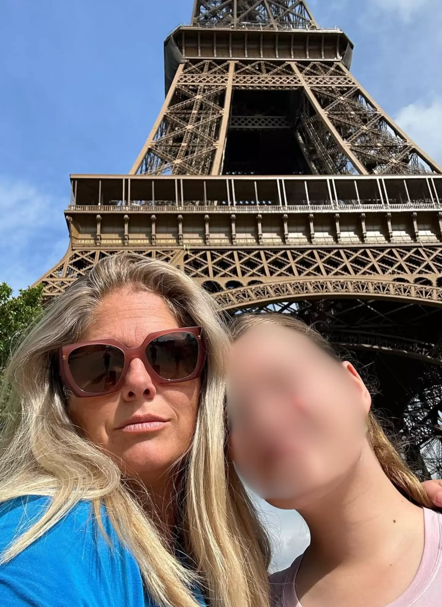 Schmidt pictured underneath the Eiffel Tower with her daughter (Instagram/soozieschmidt)