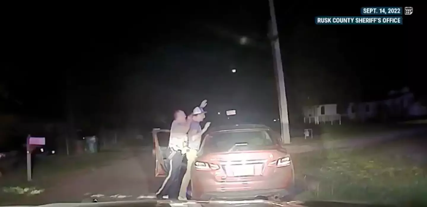 Randall could be seen complying by raising his hands before the altercation (NBC News)