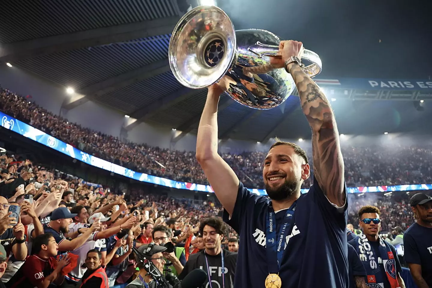 Gianluigi Donnarumma celebrates after winning the Champions League trophy with PSG (Image: Getty)