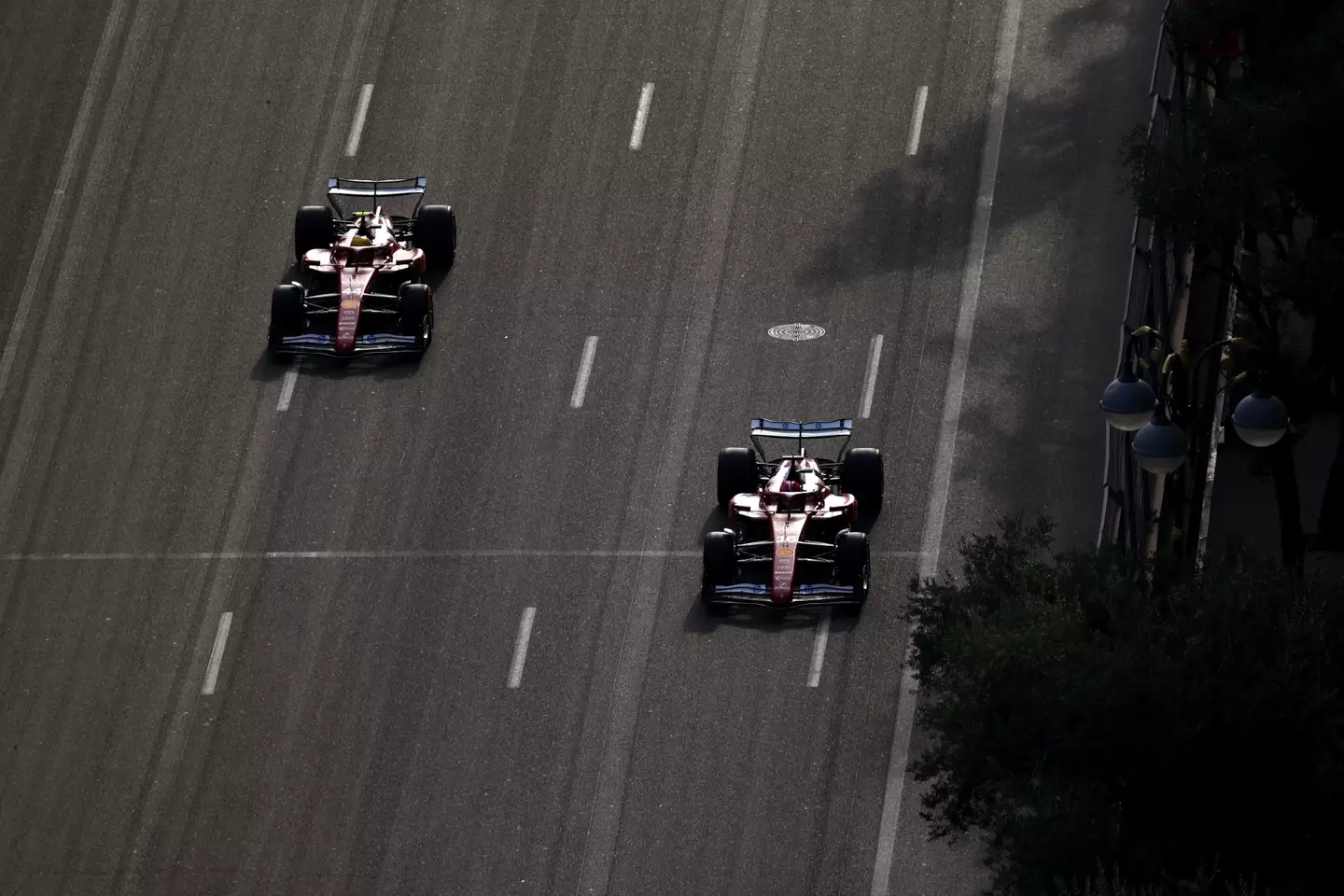Lewis Hamilton and Charles Leclerc swapping positions in Baku (credit: getty)