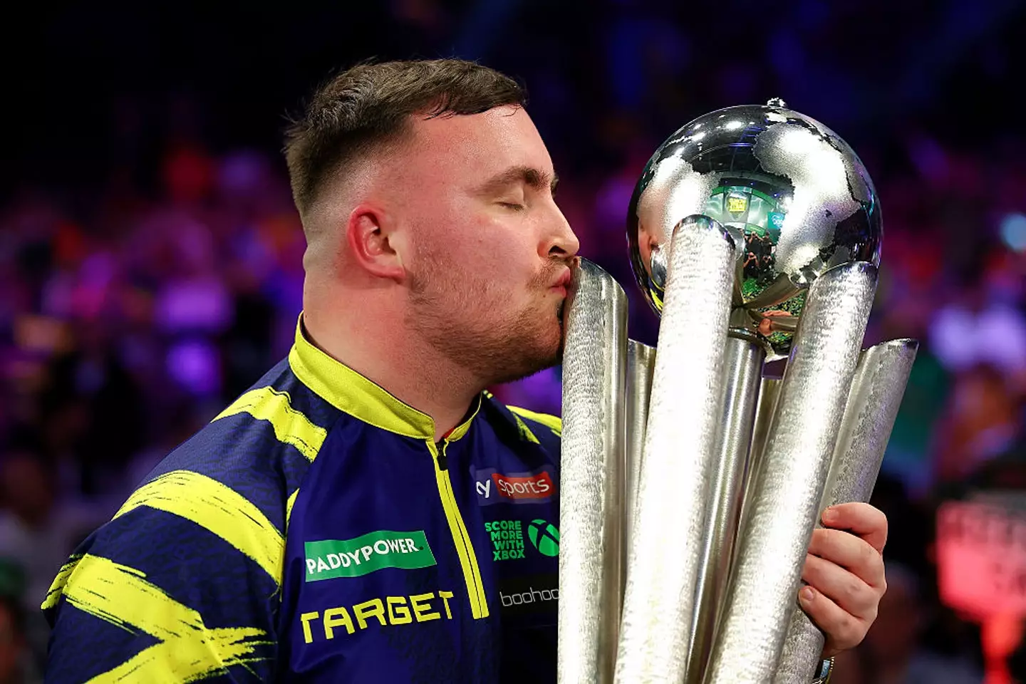Luke Littler claimed the 2026 PDC World Darts Championship with a 7-1 win over Gian van Veen. (Image: Warren Little/Getty Images)