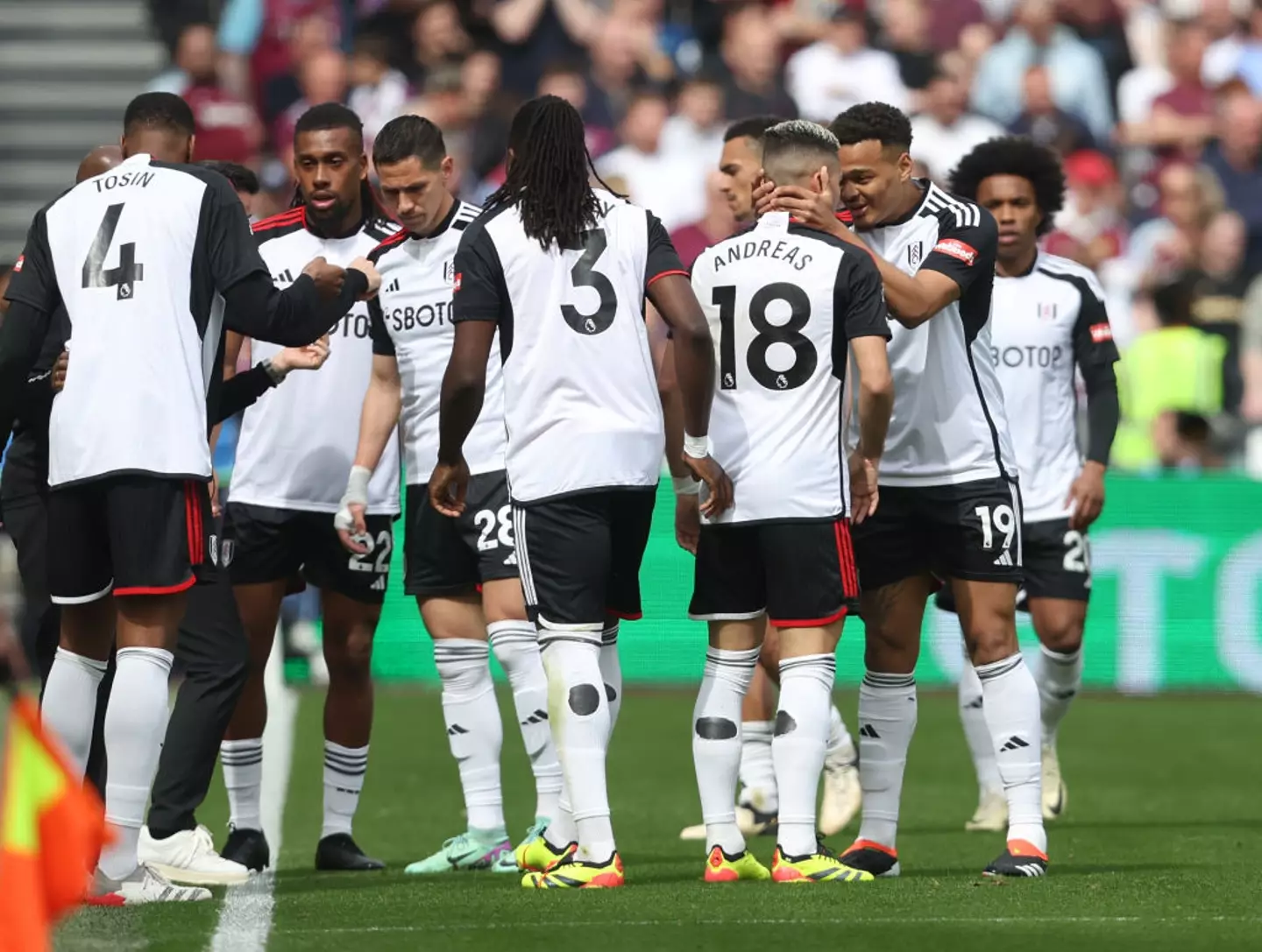 Fulham players celebrate after Andreas Pereira scores their first goal against West Ham (