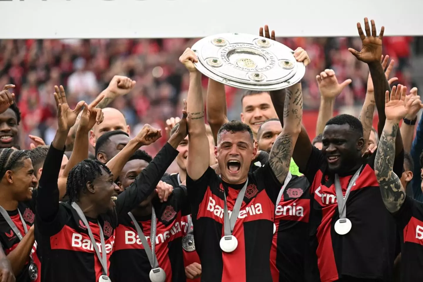 Granit Xhaka celebrates with the Bundesliga trophy -