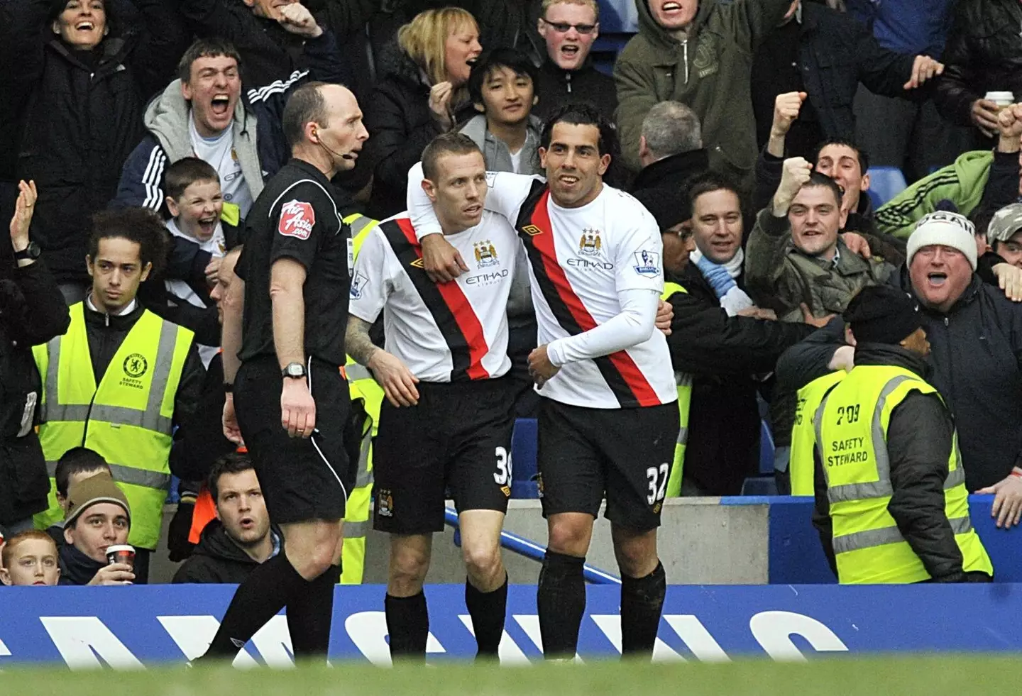 Bellamy and Tevez in action for Manchester City. Image