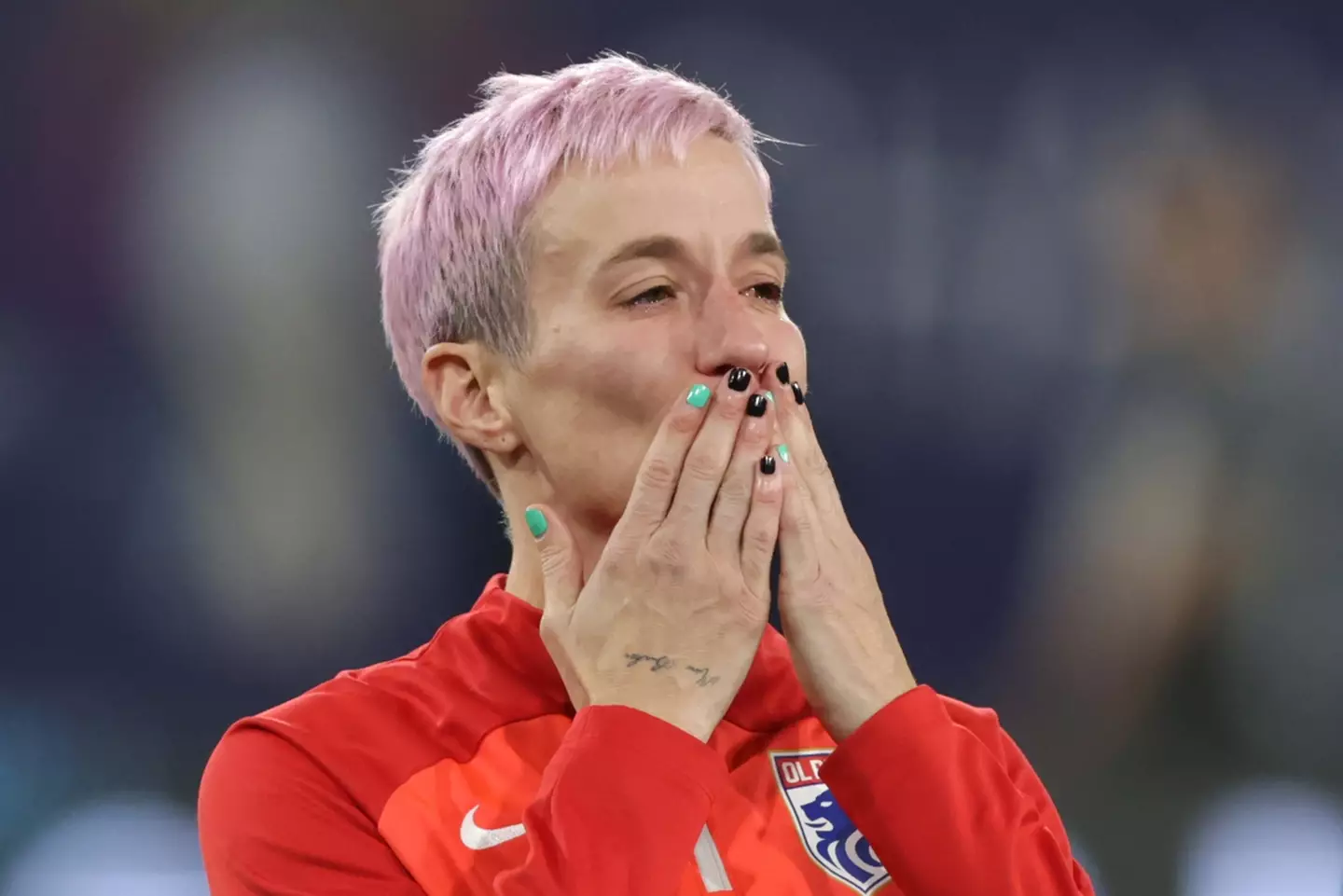 Rapinoe blowing a kiss to supporters. (Image