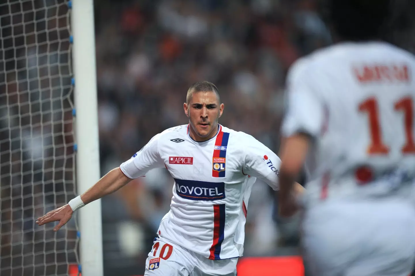 Karim Benzema celebrates scoring a goal for Lyon. Image: Getty