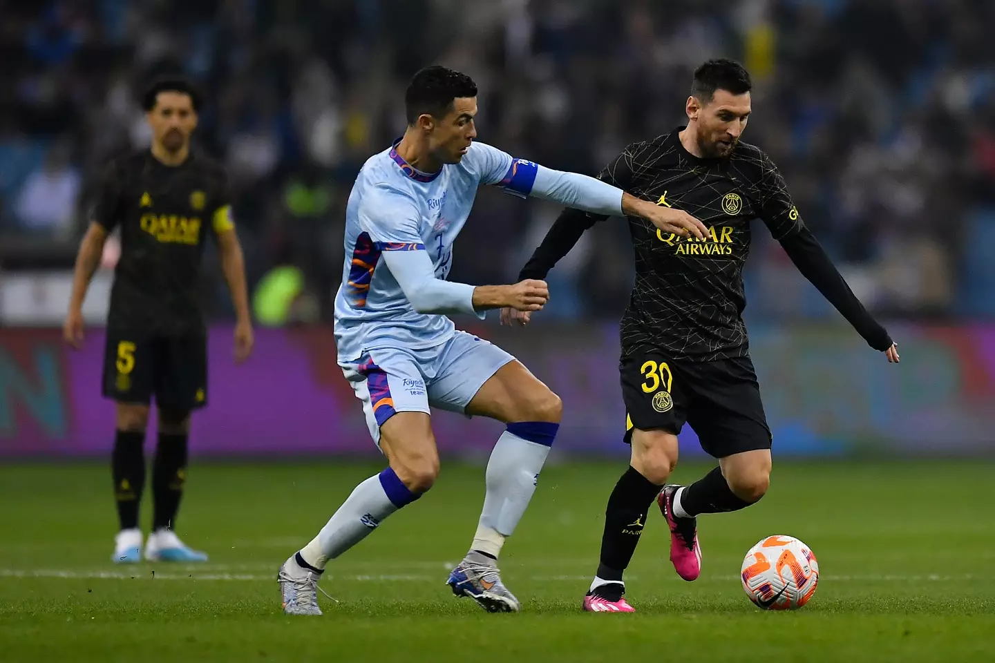 Cristiano Ronaldo and Lionel Messi competing against each other. Image: Getty 