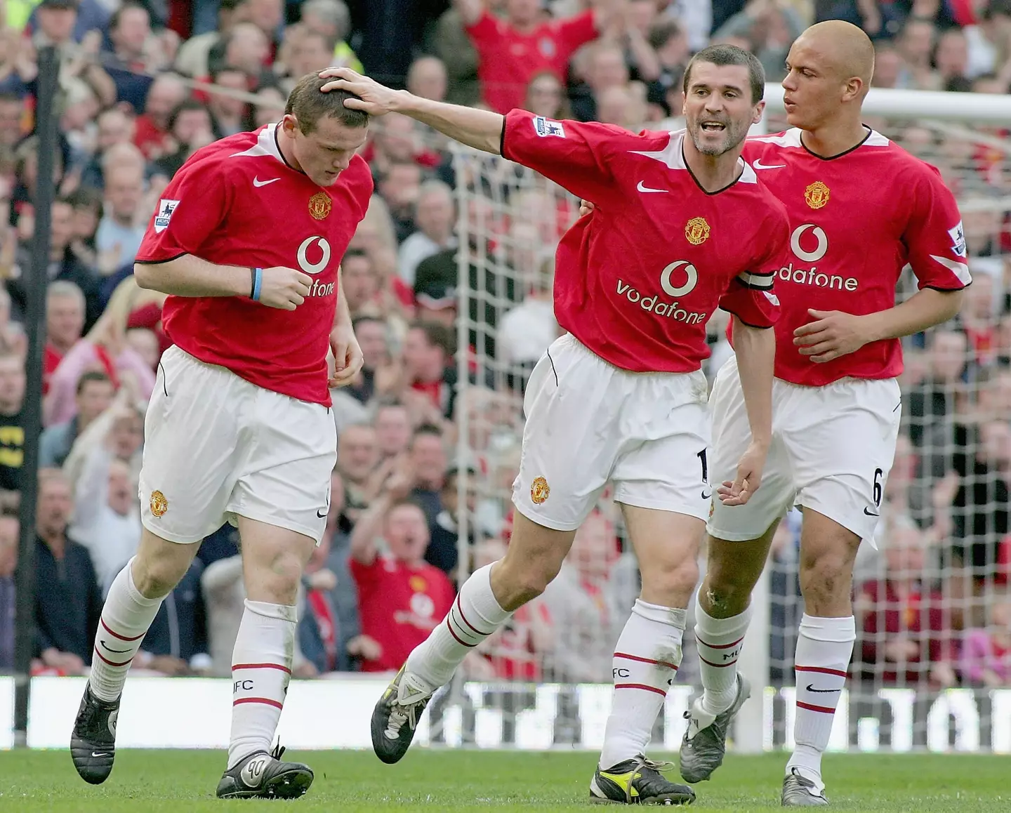 Roy Keane and Wayne Rooney in action for Manchester United. (