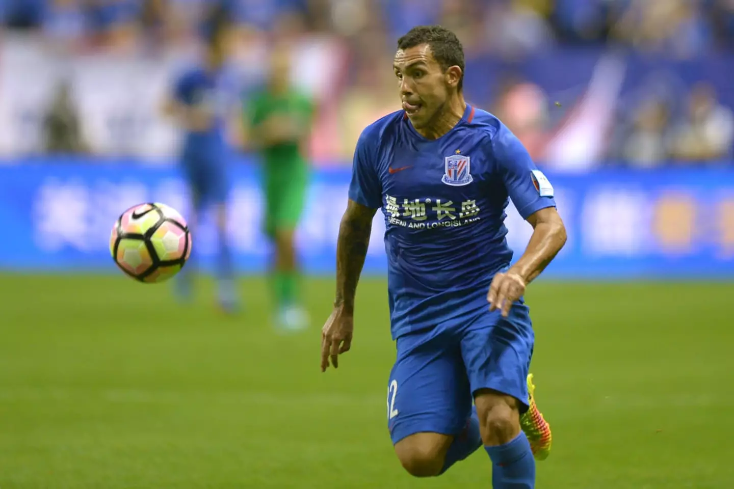Carlos Tevez pictured in action for Shanghai Shenhua in 2017 (Image: Getty)
