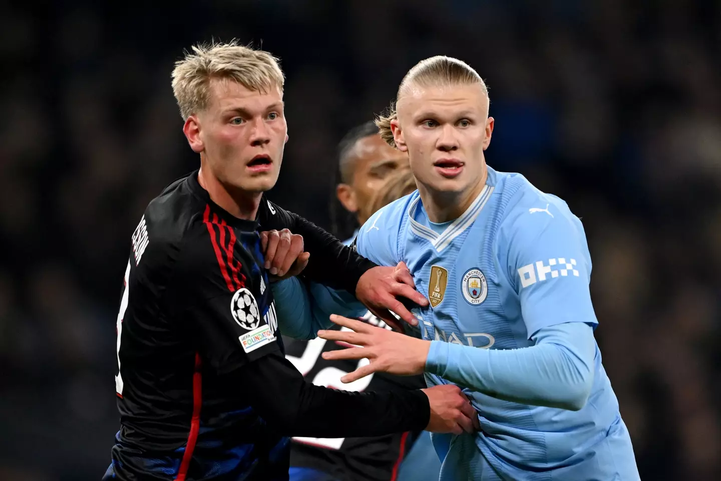 Orri Oskarsson battles for the ball with Erling Haaland during a Champions League tie between FC Copenhagen and Manchester City -
