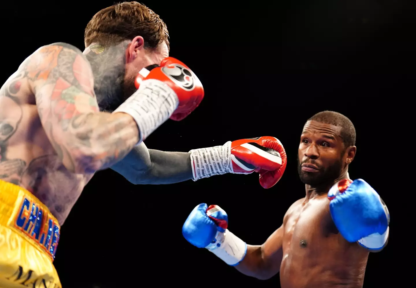 Floyd Mayweather and Aaron Chalmers during their exhibition bout. Image: Alamy