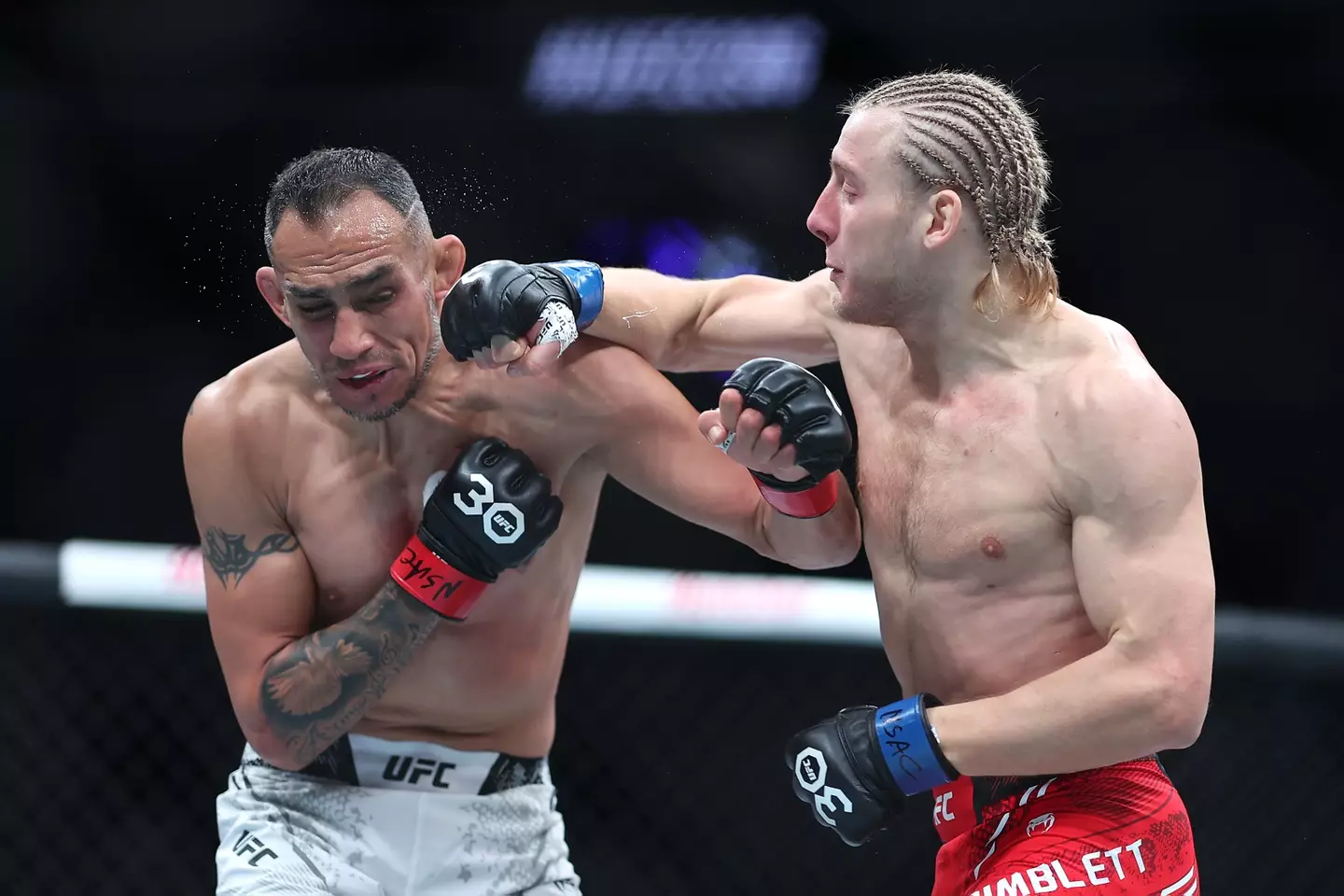 Tony Ferguson eats a punch from Paddy Pimblett. Image: Getty