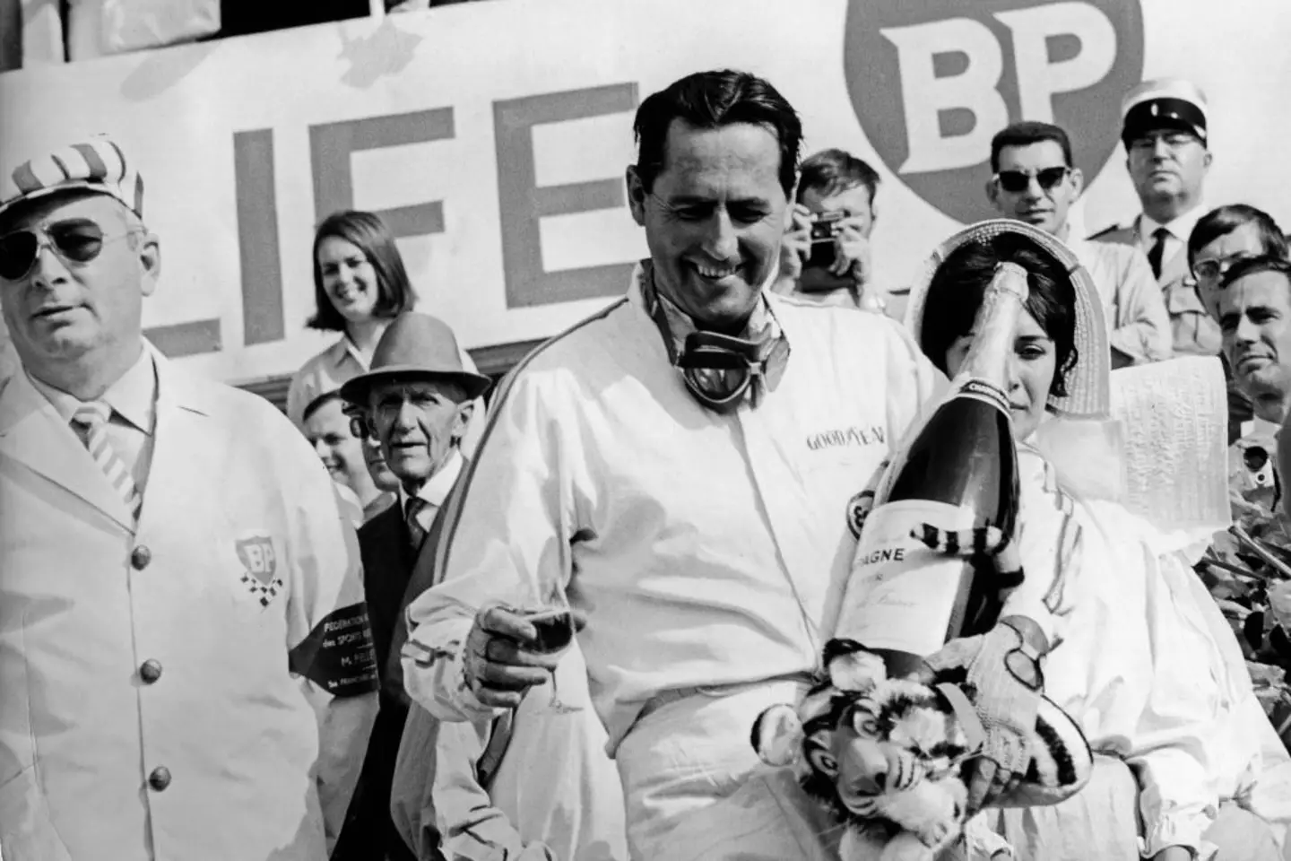 Jack Brabham celebrates after winning the 1966 French GP (Image: Getty)