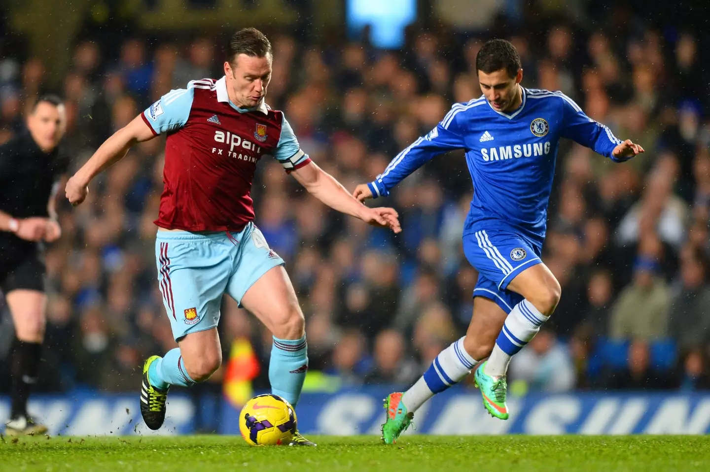 Kevin Nolan and Eden Hazard during a Premier League fixture. Image: Getty