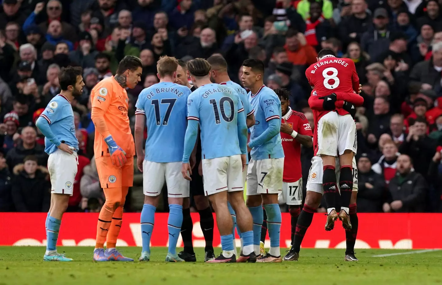 Fernandes celebrates his goal whilst City players protest. Image: Alamy