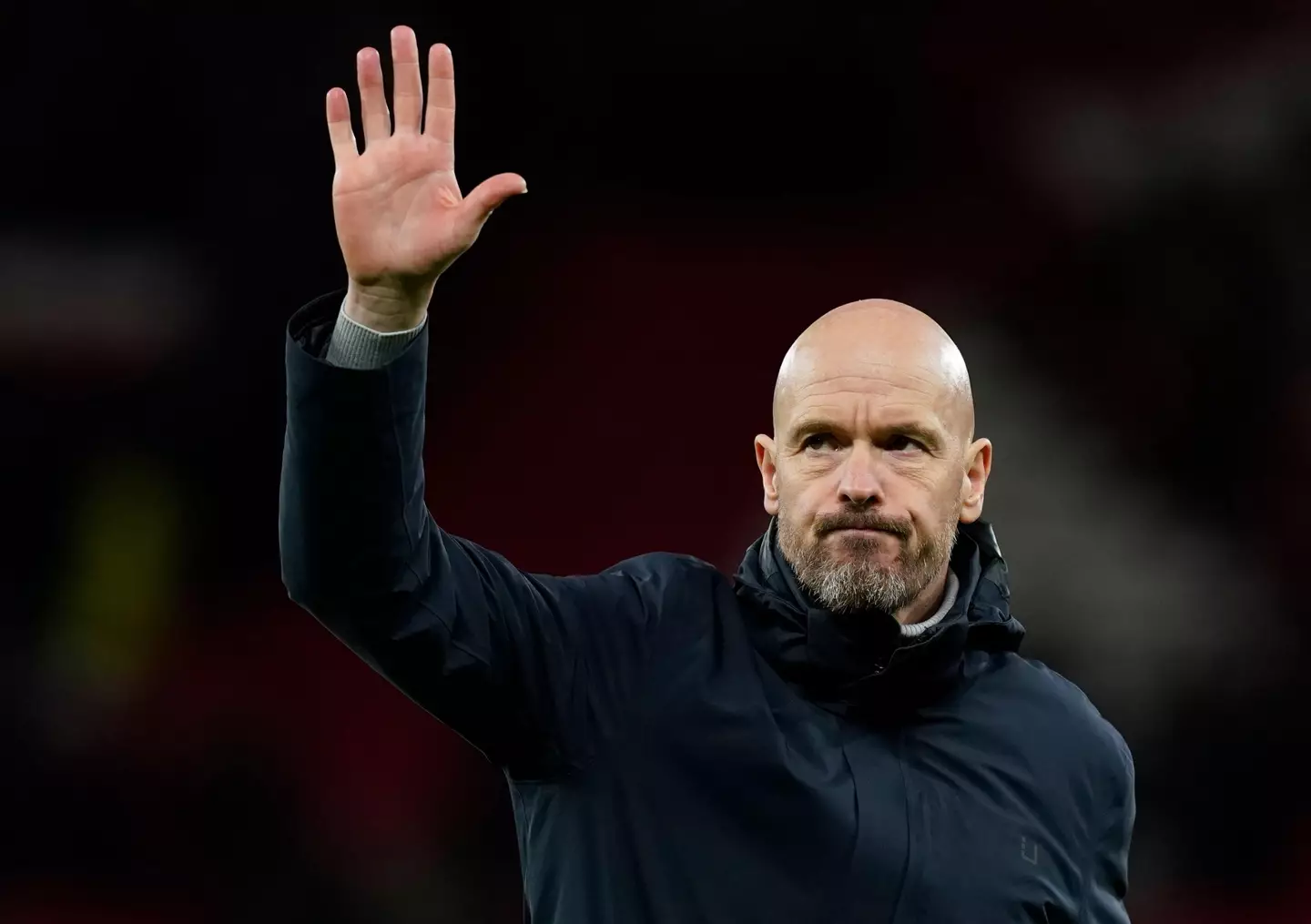 Erik ten Hag gestures to the Old Trafford crowd after Man United's draw against Sevilla. Image: Alamy