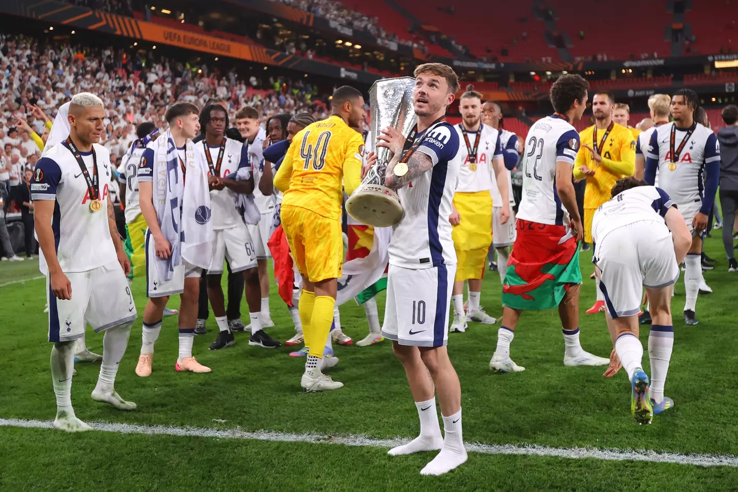 James Maddison wore his full kit for Spurs' Europa League trophy presentation. Image: Getty