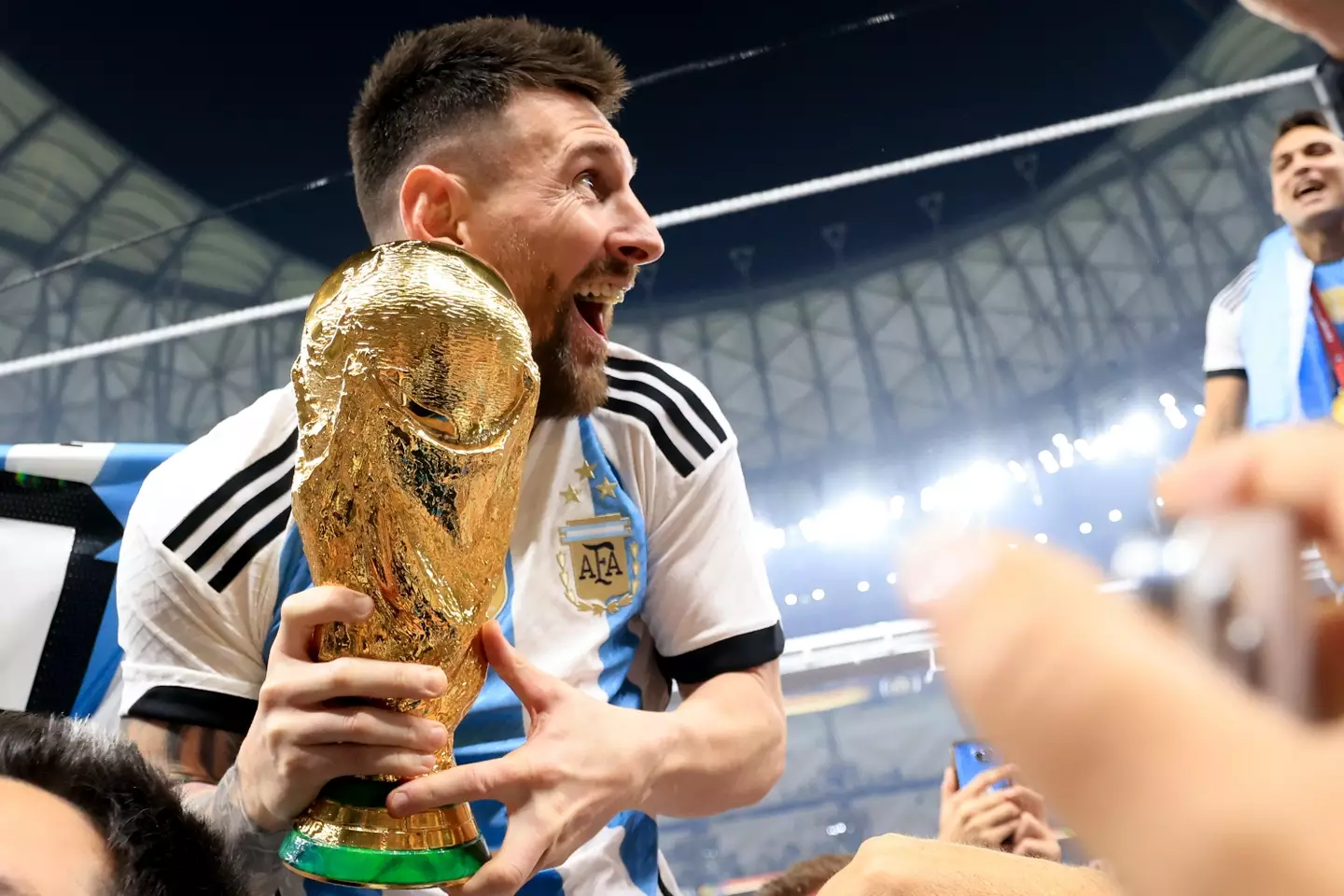 Lionel Messi celebrates winning the World Cup with Argentina. Image: Getty