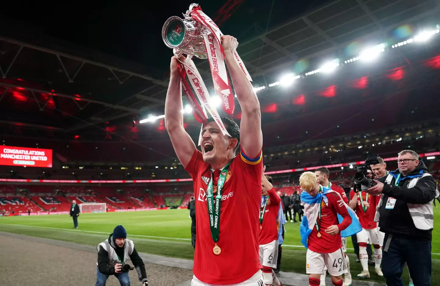 Maguire holding the Carabao Cup. (Image