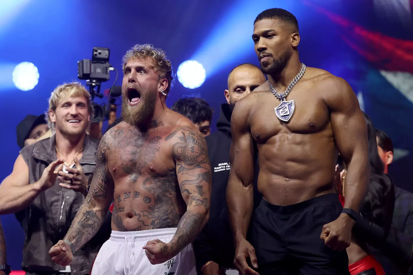 Jake Paul and Anthony Joshua during their weigh-in (Image: Getty)