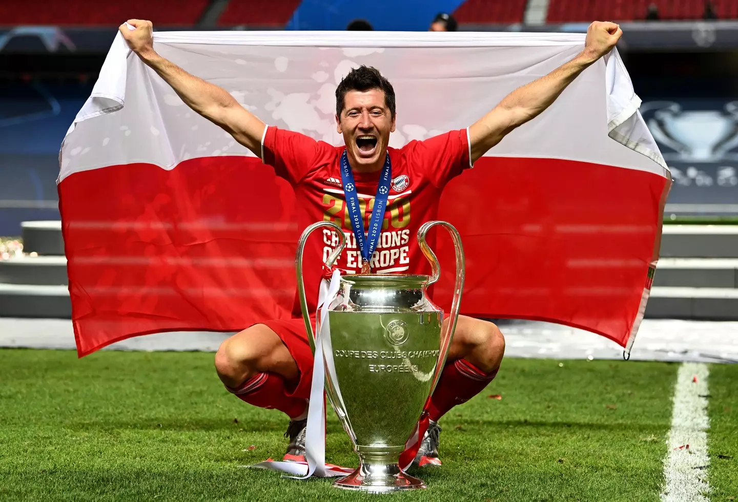 Robert Lewandowski celebrating with the Champions League trophy. (Image