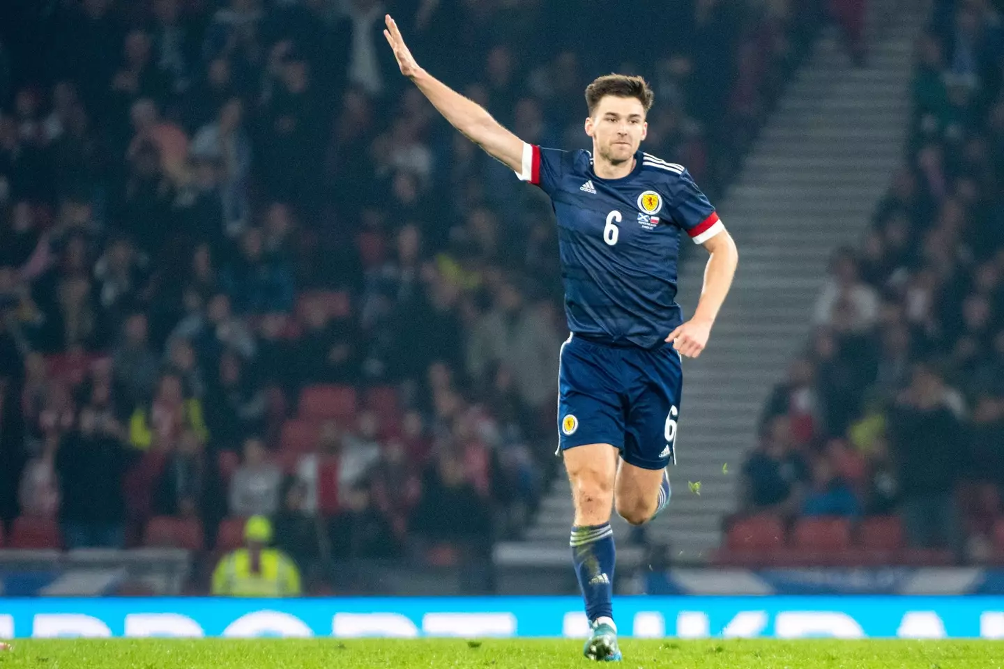 Kieran Tierney of Scotland celebrates scoring during the International Friendly Match between Scotland and Poland at Hampden Park in Glasgow, Scotland on March 24, 2022 (Photo by Andrew Surma/