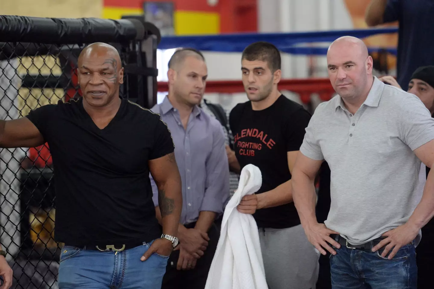 Mike Tyson and Dana White watch a Ronda Rousey training session. Image: Getty