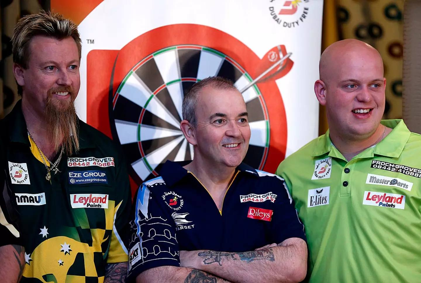 Simon Whitlock (pictured with Phil Taylor and Michael van Gerwen in 2014) lost his PDC tour card last year (Image: Getty)