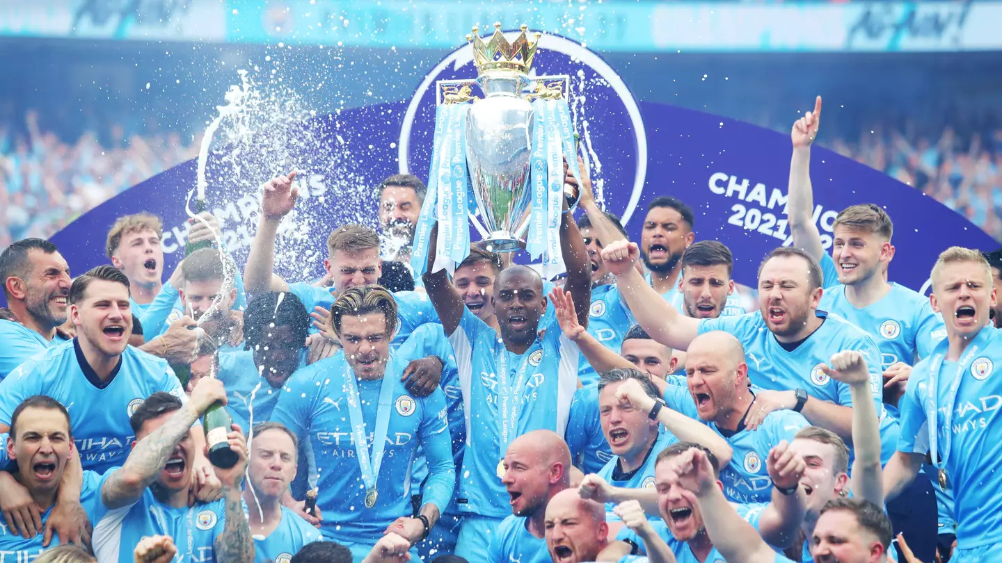 Manchester City lift the Premier League trophy for 2021/22.