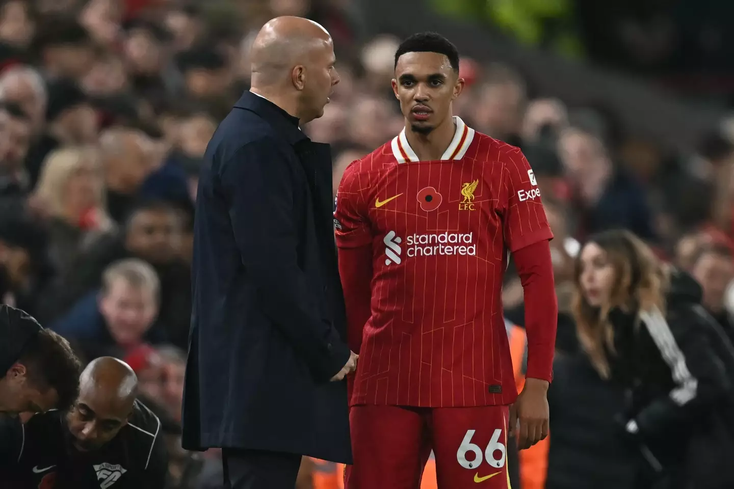 Trent Alexander-Arnold speaks to Arne Slot after being forced off with an injury. Image: Getty