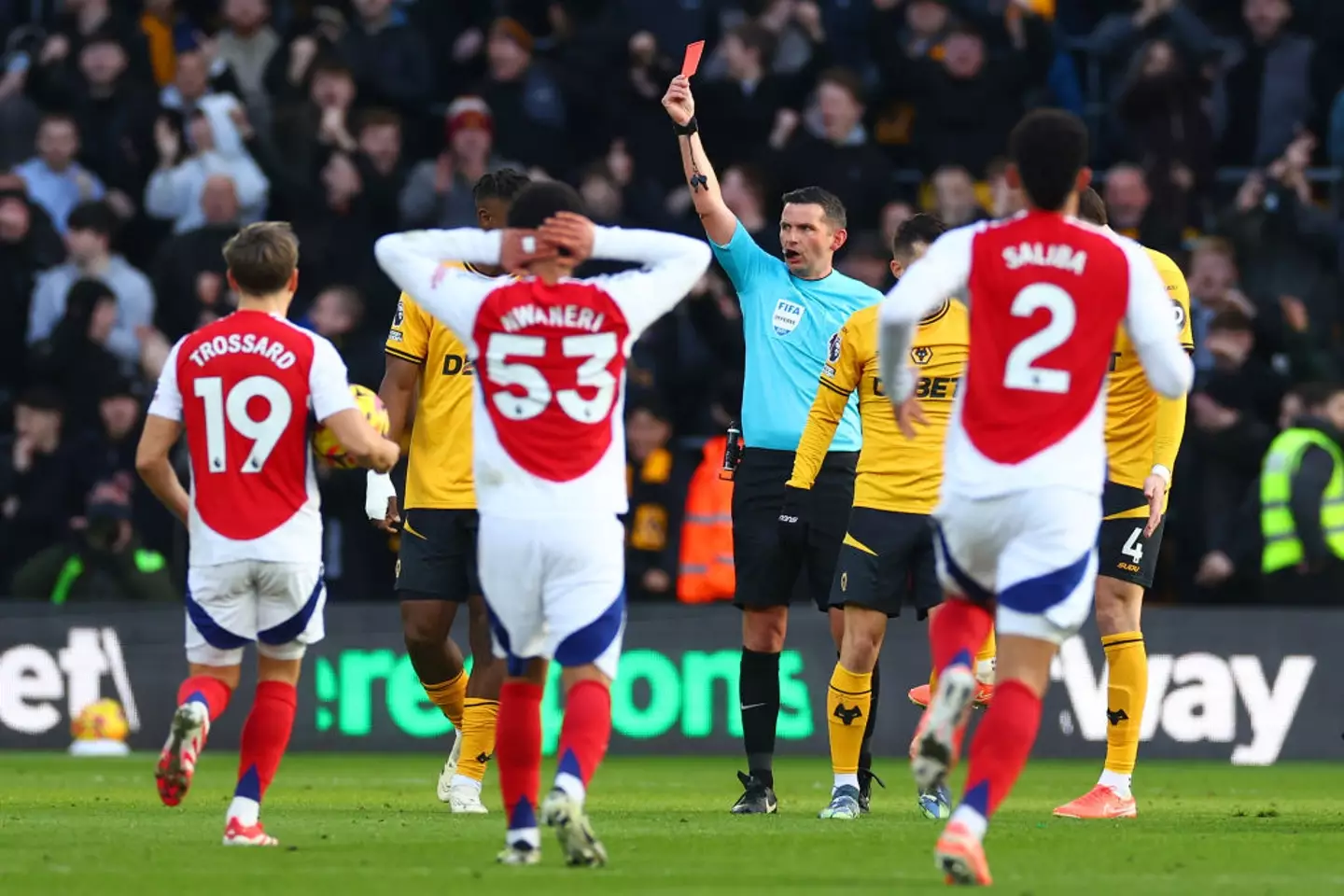 Michael Oliver sent off Arsenal's Myles Lewis-Skelly for a challenge on Matt Doherty. Image credit: Getty