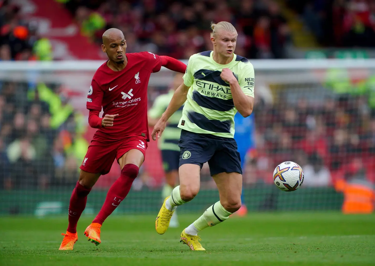Manchester City's Erling Haaland battles with Liverpool's Fabinho (PA Images/Alamy)