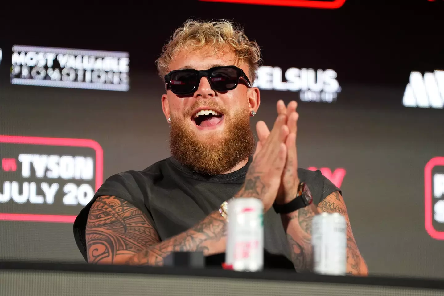Jake Paul gestures to the crowd during a presser. Image: Getty