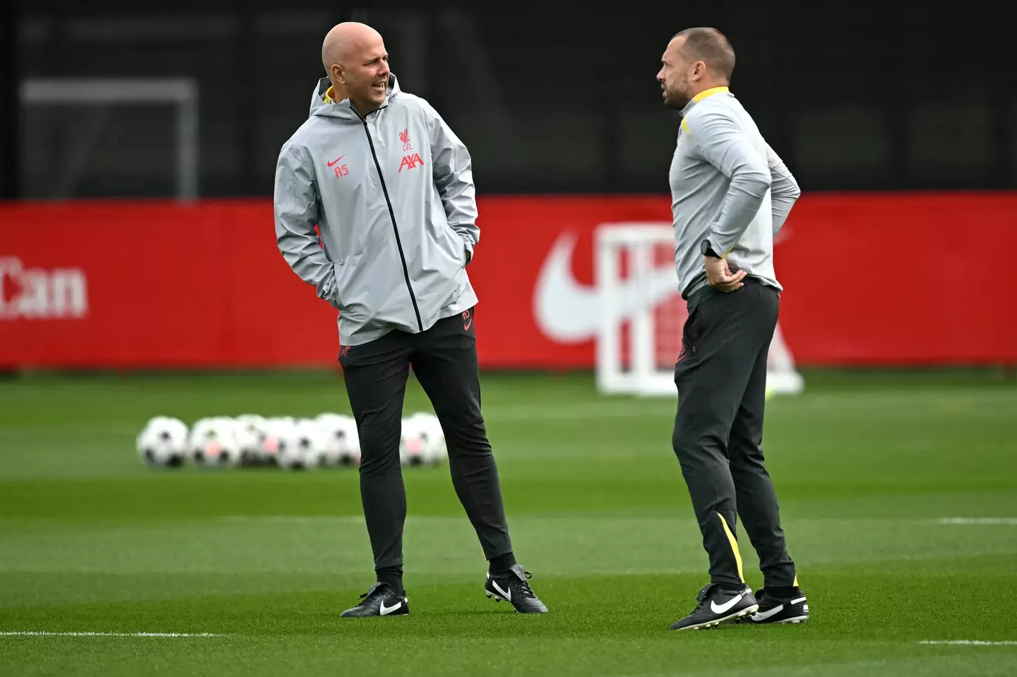 John Heitinga with Arne Slot during a Liverpool training session. Image: Getty