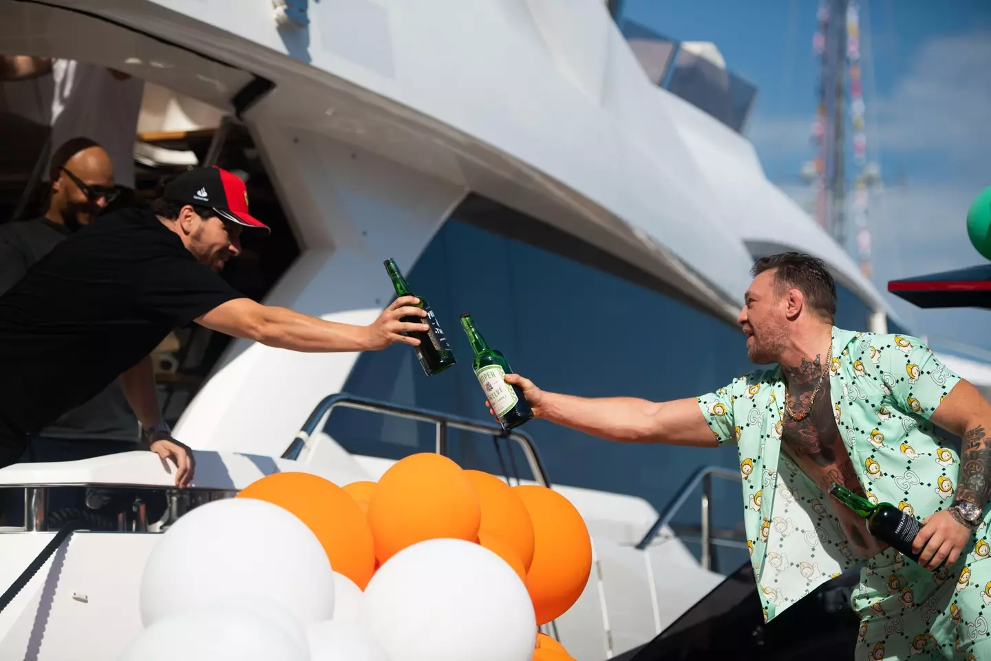 McGregor enjoys a Proper Twelve whiskey with his Monaco 'neighbour.' Image: Alamy