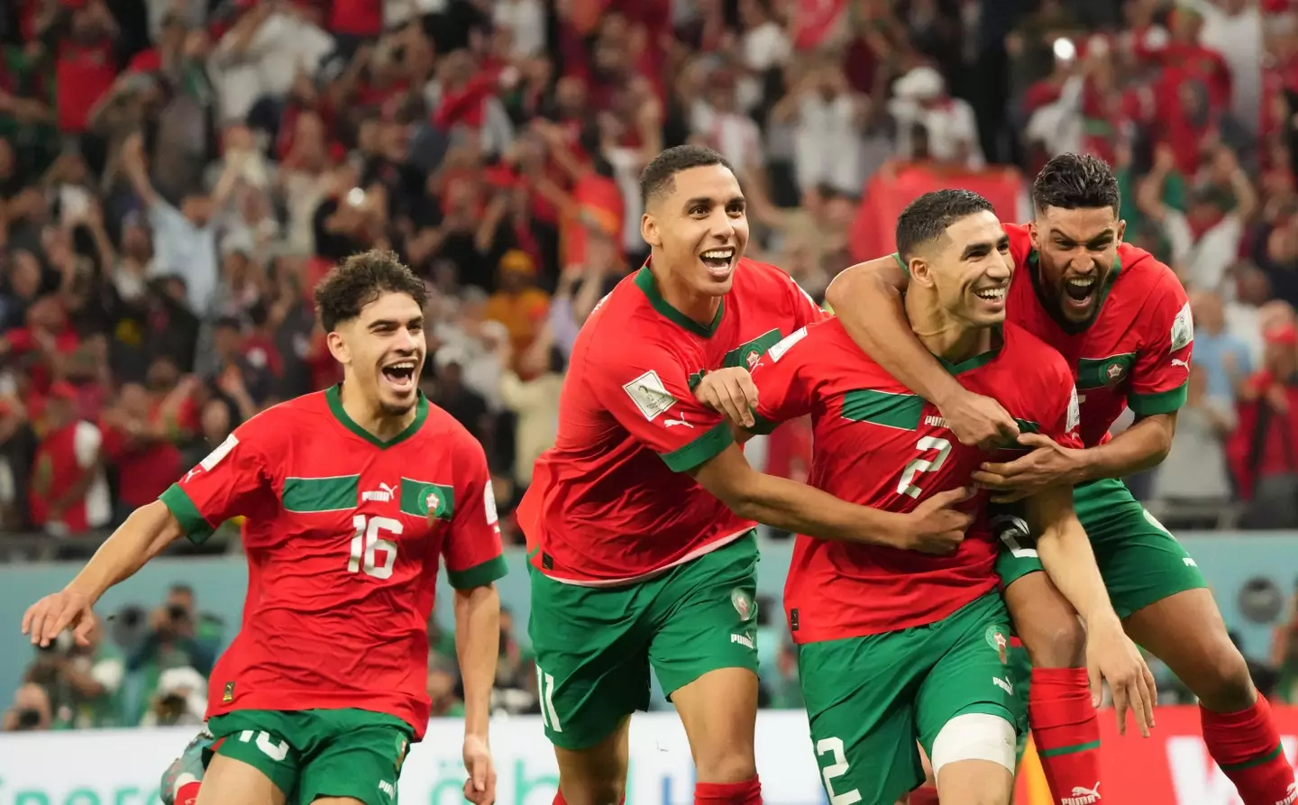 Morocco players celebrate their win over Spain. (Image