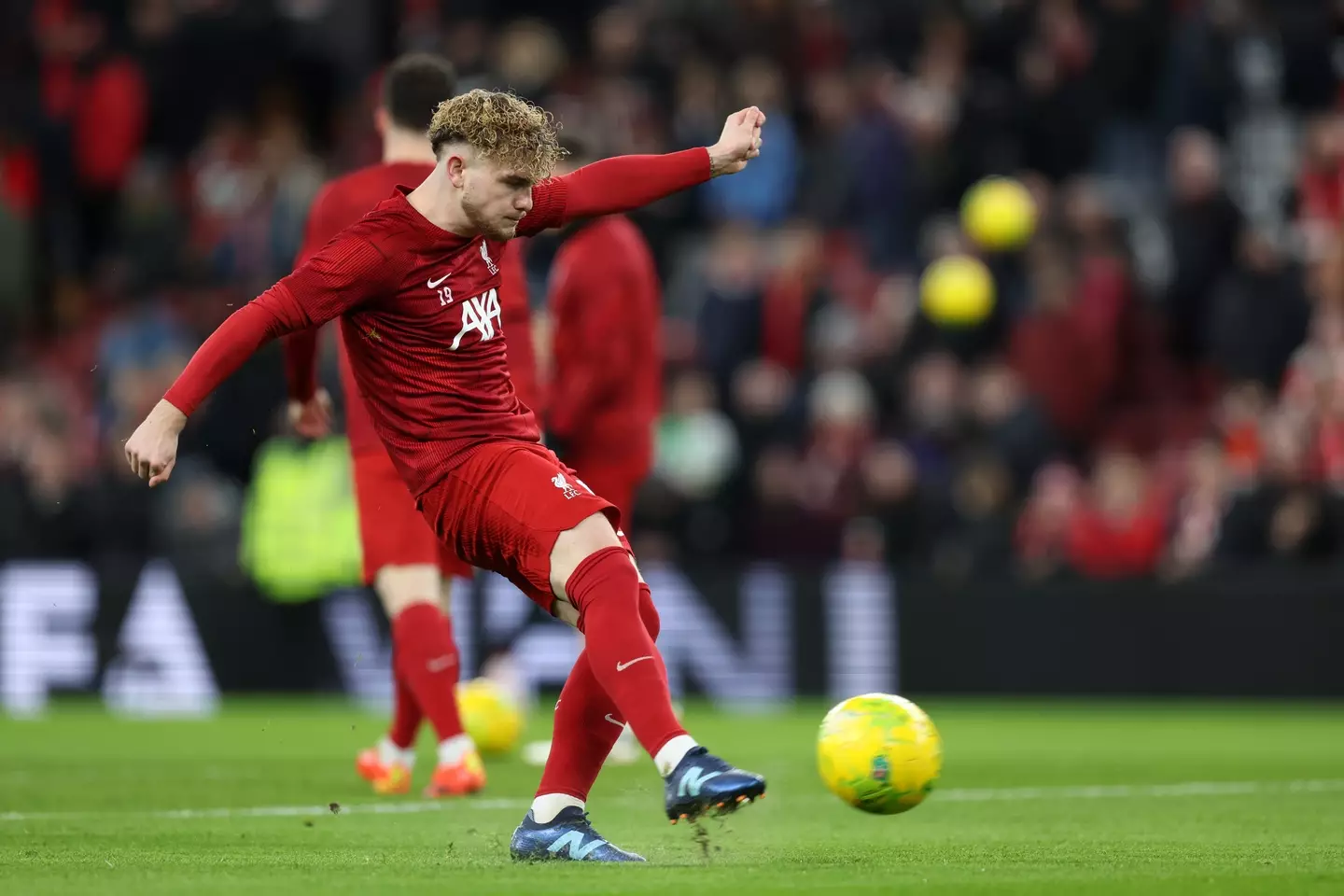 Harvey Elliott warming up ahead of Liverpool vs. Fulham. Image: Getty