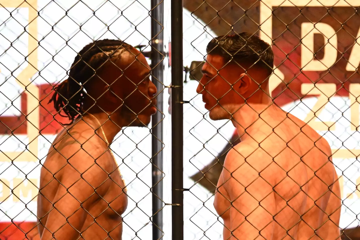 KSI and Tommy Fury face off in cage. Image: Getty
