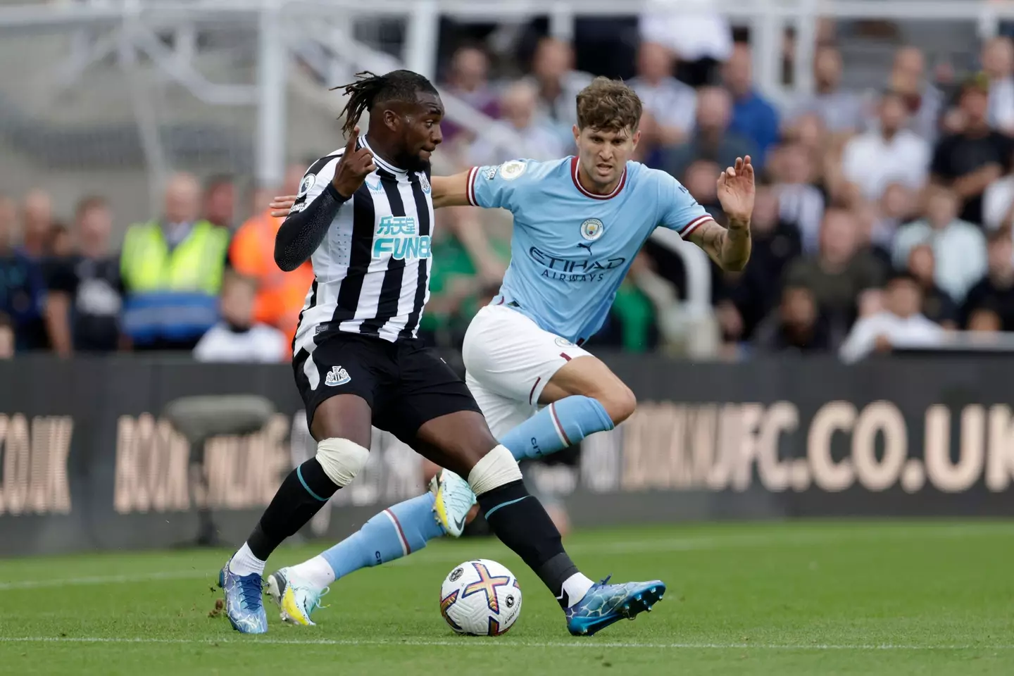 Saint-Maximin jostles with John Stones for the ball. (Image