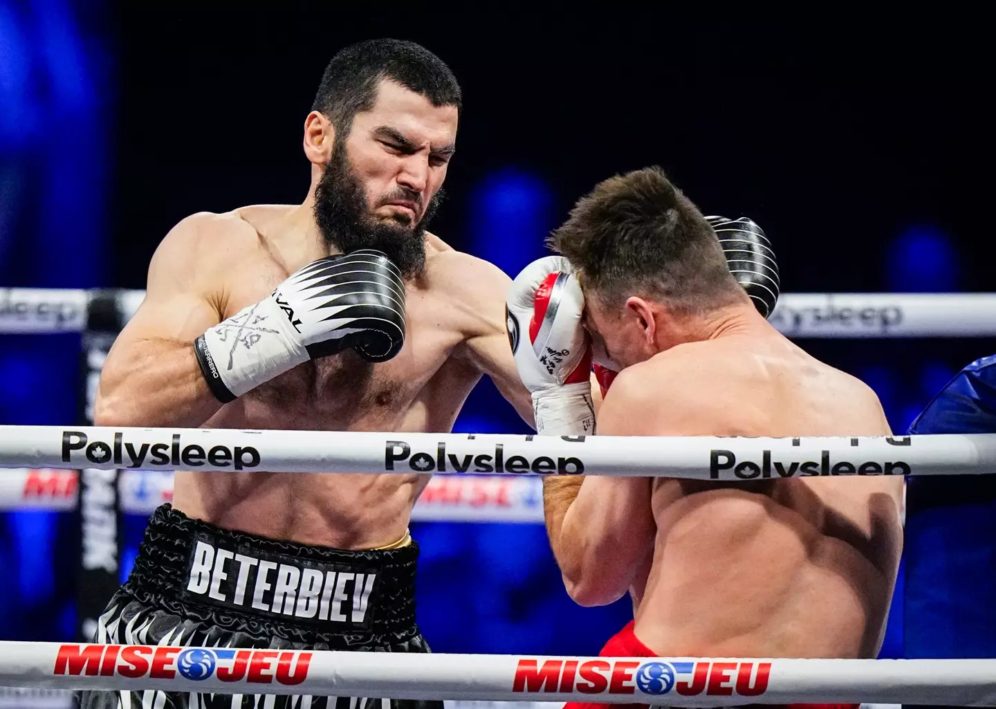 Artur Beterbiev lands a punch on Callum Smith. Image: Getty