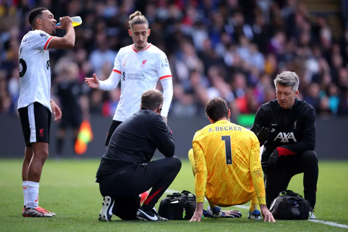 Liverpool goalkeeper Alisson Becker was forced off during the Premier League match against Crystal Palace. (Image: Getty)