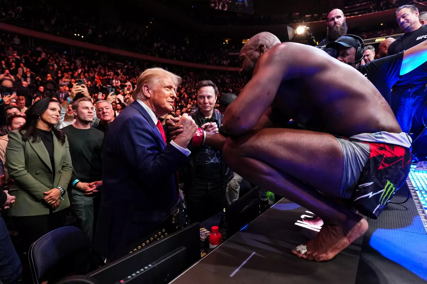 Jon Jones and Donald Trump share a warm embrace at UFC 309. Image: Getty