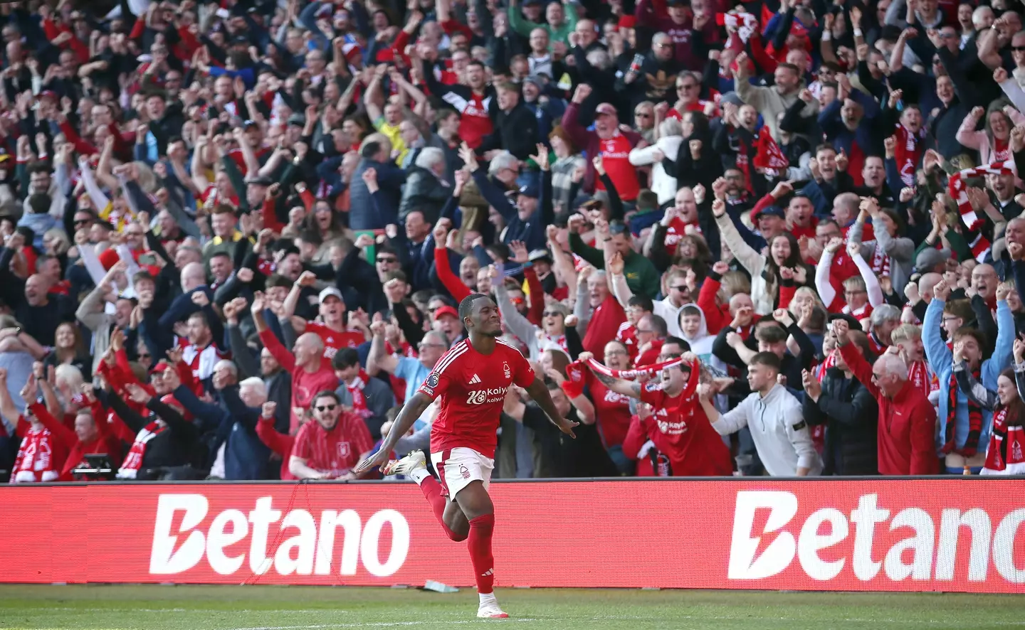 Callum Hudson-Odoi wheels away in celebration after scoring against Manchester City. Image: Getty