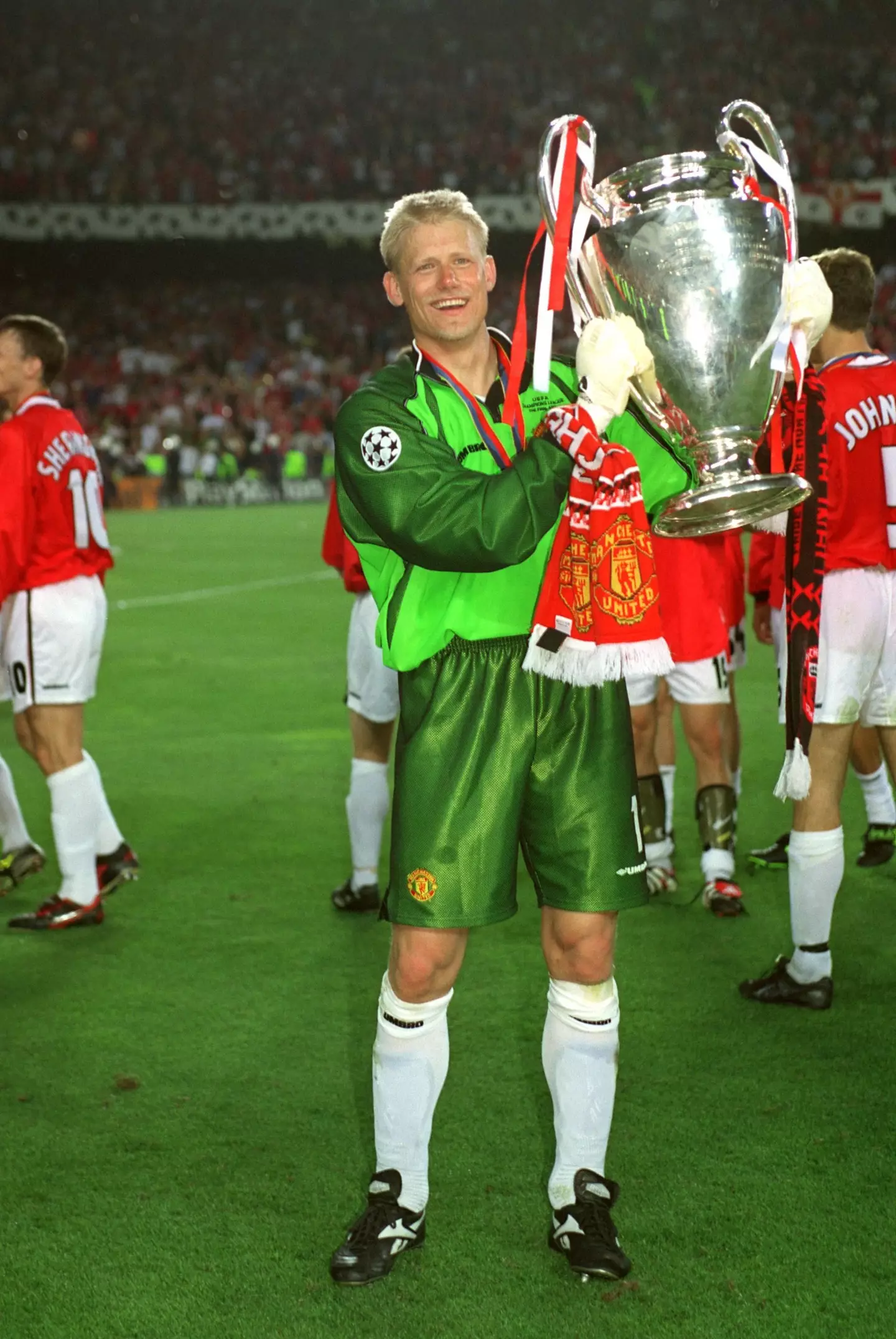 Peter Schmeichel celebrates with the Champions League trophy in 1999 (Alamy)